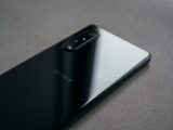 a close up of the back of a black sony phone