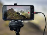 a cell phone is attached to a tripod