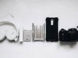 white Sony headphones and black smartphone case