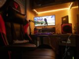 A dimly lit room showcasing an advanced gaming desktop setup with modern equipment.