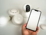 Showcase of various smart home devices controlled via a smartphone, highlighting automation and security.