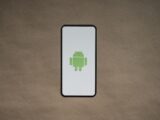 a cell phone with a green icon on it