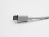 a close up of a white cable on a white surface