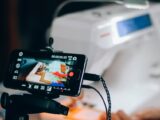 Smartphone capturing sewing machine process, perfect for DIY and crafting content.
